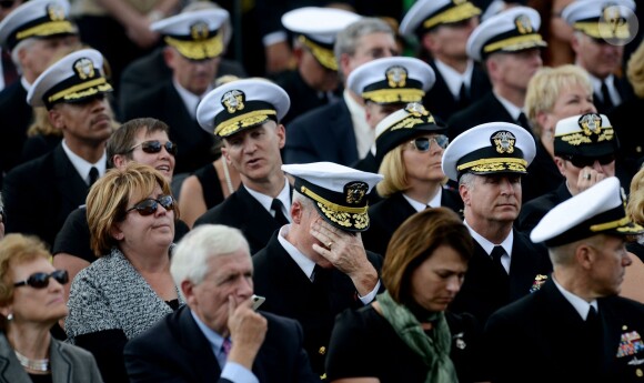 Barack Obama et Michelle Obama ont assisté à une cérémonie hommage aux victimes de la tuerie de Navy Yard, le 22 septmbre 2013 à Washington. Le couple a réconforté les familles et le président a délivré un discours.