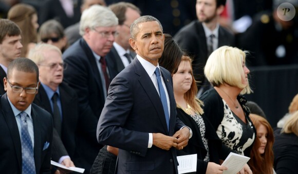 Barack Obama et Michelle Obama ont assisté à une cérémonie hommage aux victimes de la tuerie de Navy Yard, le 22 septmbre 2013 à Washington. Le couple a réconforté les familles et le président a délivré un discours.