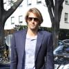 Le charmant frenchy Camille Lacourt arrive au défilé Armani le 23 septembre 2013 à Milan