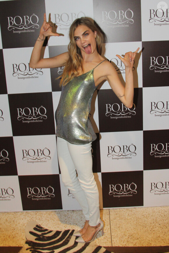 Cara Delevingne assiste au cocktail de lancement de la collection d'été de la marque Bo.Bô. Rio de Janeiro, le 3 octobre 2013.