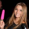 Clara (Secret Story 7) s'amuse avec des sex toys lorsqu'elle assiste à l'inauguration de l'exposition "Sex in the city", un événement Solidarité Sida sur la place de la Bastille à Paris, le 7 octobre 2013