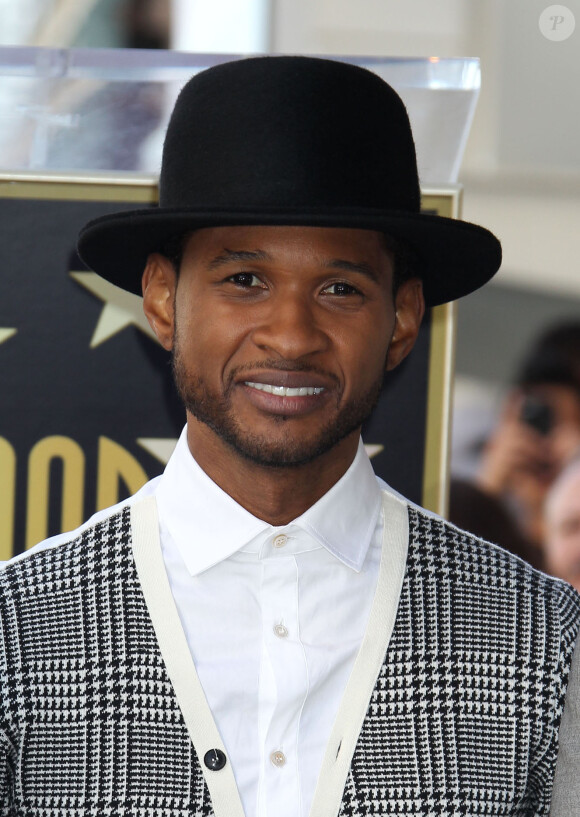 Usher assiste à la remise de l'étoile de Kenny 'Babyface' Edmonds sur le Hollywood Walk of Fame, le 10 octobre 2013.