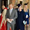 Mike Tindall et Zara Phillips, désignée comme marraine et enceinte de son premier enfant, au baptême du prince George de Cambridge, fils de William et Kate, le 23 octobre 2013 au palais Saint James.