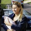 Michelle Hunziker avec sa fille Sole dans les bras à Milan le 24 octobre 2013.
