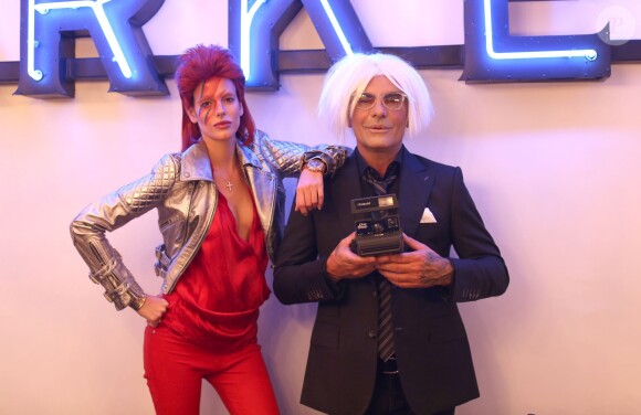 Exclusif - Christian Audigier et sa belle Nathalie Sorensen, déguisés en Andy Warhol et en Ziggy Stardust, fêtent Halloween au Soho House de Los Angeles, le 31 octobre 2013.