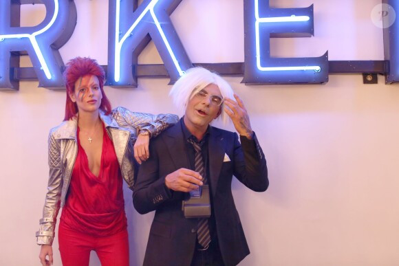 Exclusif - Christian Audigier et sa belle fiancée Nathalie Sorensen, déguisés en Andy Warhol et en Ziggy Stardust, fêtent Halloween au Soho House de Los Angeles, le 31 octobre 2013.