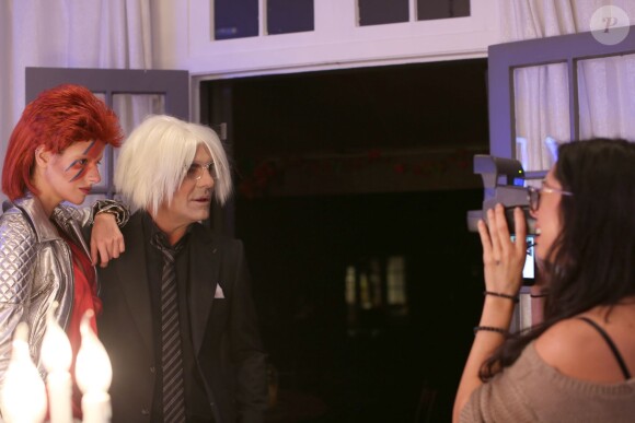 Exclusif - Christian Audigier et sa belle Nathalie Sorensen, déguisés en Andy Warhol et en Ziggy Stardust, fêtent Halloween au Soho House de Los Angeles, le 31 octobre 2013.
