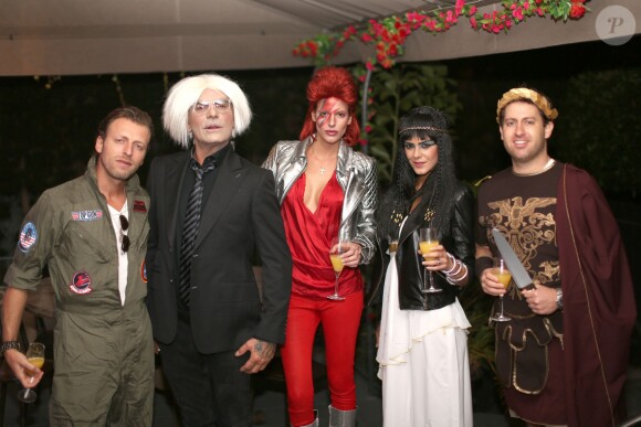 Exclusif - Christian Audigier et sa belle Nathalie Sorensen, déguisés en Andy Warhol et en Ziggy Stardust, fêtent Halloween au Soho House de Los Angeles, le 31 octobre 2013.