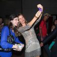 Gisele Bundchen spendide au Brésil dans une robe à franges pour une soirée Oral B dont elle est l'égérie. Le 10 décembre 2013 à Sao Paulo