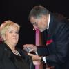 Mimie Mathy a reçu les insignes de Chevalier de l'Ordre National du Mérite des mains de Jean-Claude Camus à l'issue de son spectacle "Je re-papote avec vous" au théâtre de la Porte Saint-Martin à Paris, le 13 decembre 2013.