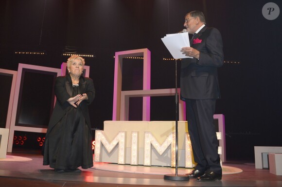Mimie Mathy a reçu les insignes de Chevalier de l'Ordre National du Mérite des mains de Jean-Claude Camus à l'issue de son spectacle "Je re-papote avec vous" au théâtre de la Porte Saint-Martin à Paris, le 13 decembre 2013.