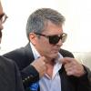 Jorge Messi, père de Lionel, arrive avec ses avocats au tribunal de Gava, près de Barcelone, le 27 septembre 2013, où il doit être entendu dans le cadre de sa mise en examen pour fraude fiscale.