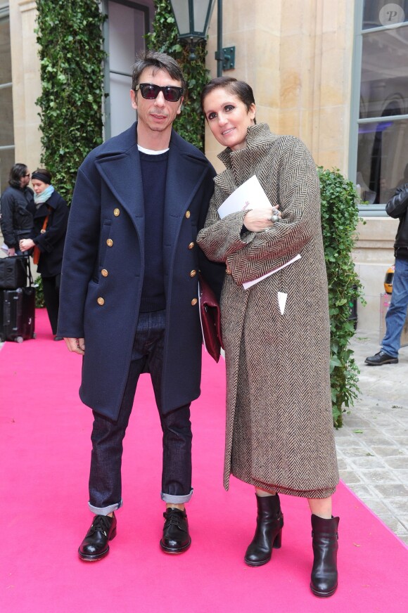 Les créateurs de Valentino, Pierpaolo Piccioli et Maria Grazia Chiuri, au défilé Schiaparelli Haute couture printemps-été 2014 à Paris, le 20 janvier 2014.
