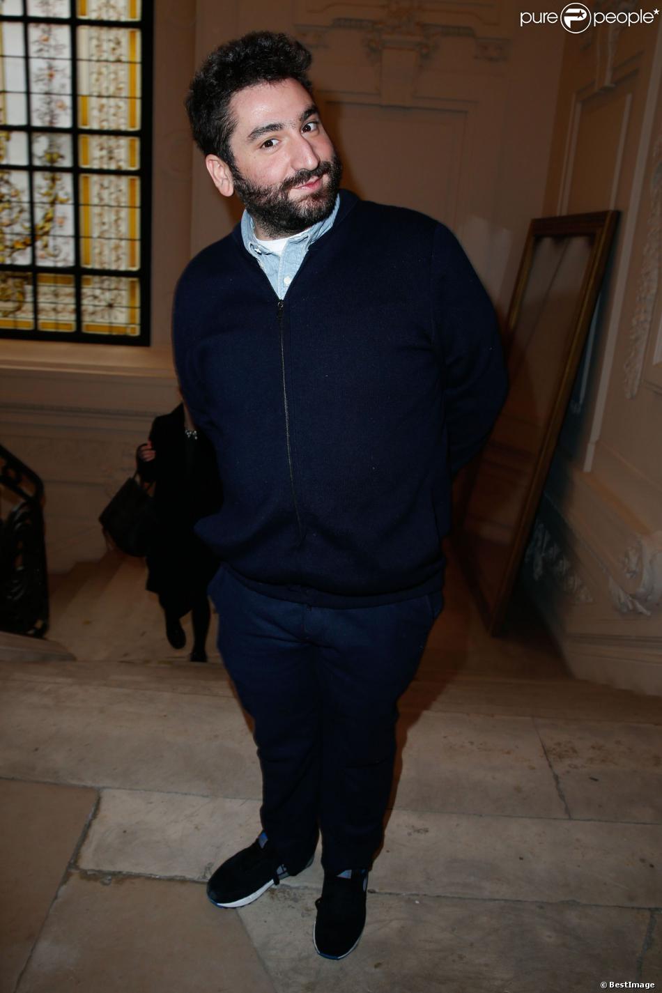Mouloud Achour assiste au défilé haute couture printemps-été 2014 de Jean Paul Gaultier, dans son atelier situé dans le 3e arrondissement. Paris, le 22 janvier 2014.