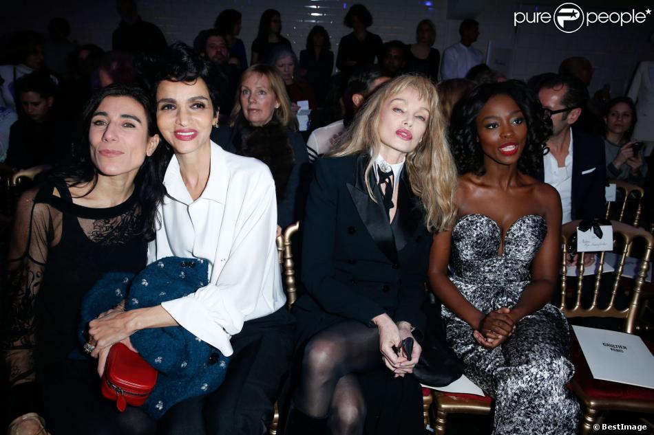 Bianca Li, Farida Khelfa, Arielle Dombasle et Aissa Maïga assistent au défilé haute couture printemps-été 2014 de Jean Paul Gaultier, dans son atelier situé dans le 3e arrondissement. Paris, le 22 janvier 2014.