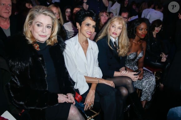 Catherine Deneuve, Farida Khelfa, Arielle Dombasle et Aissa Maïga assistent au défilé haute couture printemps-été 2014 de Jean Paul Gaultier, dans son atelier situé dans le 3e arrondissement. Paris, le 22 janvier 2014.