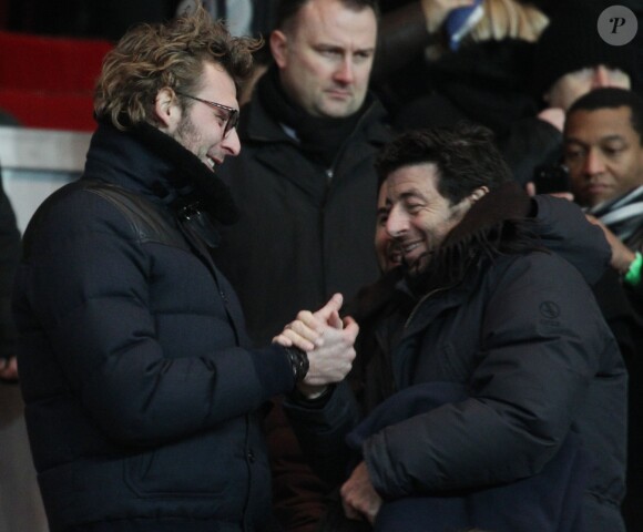 Amaury Leveaux et Patrick Bruel lors du match entre le Paris Saint-Germain et Bordeaux (2-0) au Parc des Princes le 31 janvier 2014 à Paris