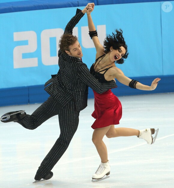 Nathalie Péchalat et Fabian Bourzat, enthousiastes lors de leur programme court de danse en patinage artistique au Iceberg Skating Palace de Sotchi, le 16 février 2014 lors des Jeux olympiques de Sotchi