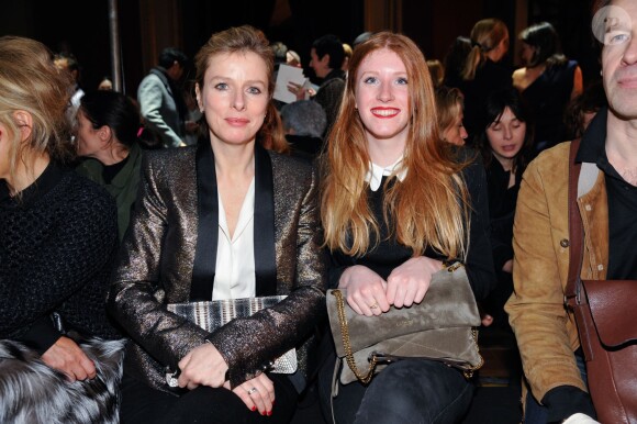 Karin Viard et sa fille ainée Marguerite assistent au défilé Lanvin automne-hiver 2014-2015 arrive à l'École Nationale des Beaux-Arts. Paris, le 27 février 2014.