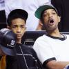 Will Smith et son fils Jaden lors du match entre Miami Heat et les Chicago Bulls à l'AmericanAirlines Arena à Miami, le 15 mai 2013.