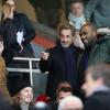 Nicolas Sarkozy présente son fils Louis à Teddy Riner lors du match entre le Paris Saint-Germain et l'Olympique de Marseille au Parc des Princes à Paris, le 2 mars 2014