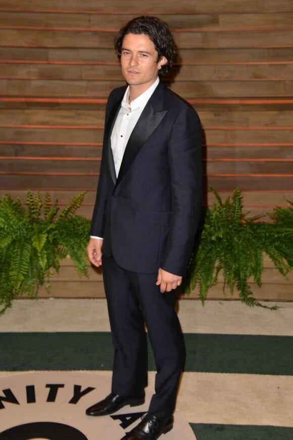 Orlando Bloom assiste à la soirée Vanity Fair après la 86e cérémonie des Oscars, habillé d'un costume Lanvin. Los Angeles, le 2 mars 2014.