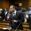 Oscar Pistorius lors du premier jour de procès devant la Haute Cour de Pretoria où il doit répondre du meurtre de Reeva Steenkamp, le 3 mars 2014