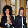 Samaha Sam et Frah du groupe Shaka Ponk décorés des insignes de chevalier de l'ordre des Arts et des Lettres par la ministre Aurélie Filippetti dans les salons du ministère de la Culture, à Paris le 18 mars 2014.