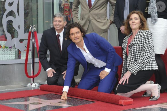 <p>Orlando Bloom et son étoile sur le Hollywood Walk of Fame à Los Angeles, le 2 avril 2014.</p>