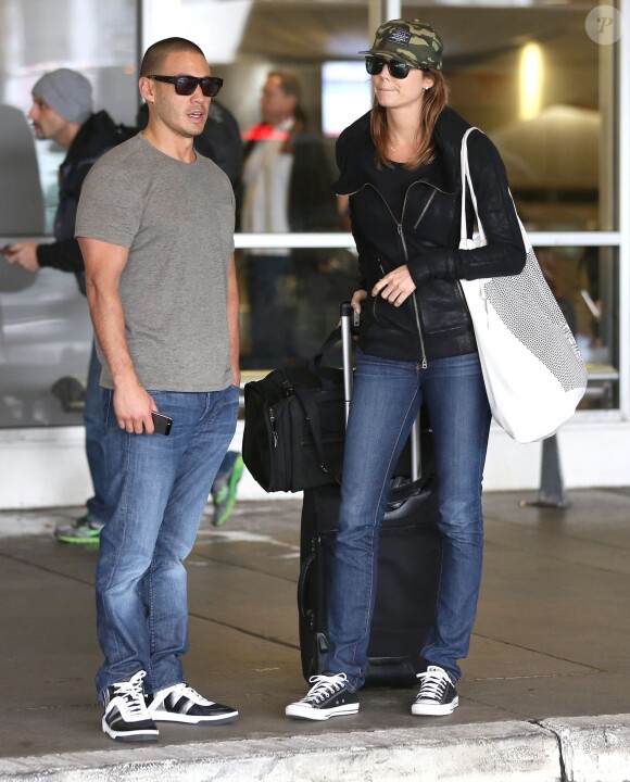 Stacy Keibler et son nouveau petit-ami Jared Pobre arrivent à l'aéroport de Los Angeles, le 7 décembre 2013
