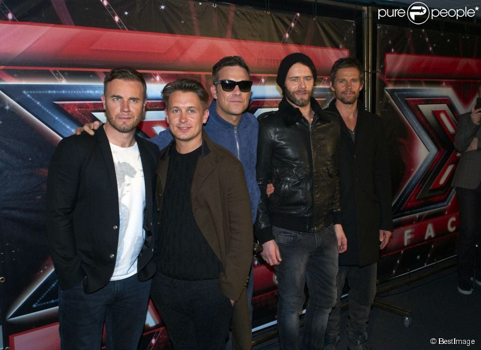  Robbie Williams, Gary Barlow, Mark Owen, Howard Donald et Jason Orange, invités de l&#039;émission X Factor, à Copenhague, le 24 mars 2011. 
  