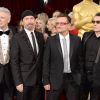 Adam Clayton, The Edge, Bono et Larry Mullen Jr. du groupe U2 - 86e cérémonie des Oscars à Hollywood, le 2 mars 2014.