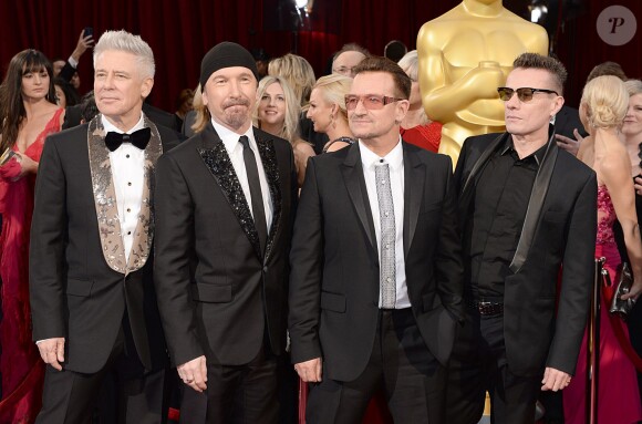 Adam Clayton, The Edge, Bono et Larry Mullen Jr. du groupe U2 - 86e cérémonie des Oscars à Hollywood, le 2 mars 2014.