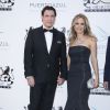 John Travolta et son épouse Kelly Preston - Photocall de la soirée "Puerto Azul Experience" lors du 67ème festival de Cannes le 21 mai 2014.