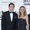 John Travolta et son épouse Kelly Preston - Photocall de la soirée "Puerto Azul Experience" lors du 67ème festival de Cannes le 21 mai 2014.
