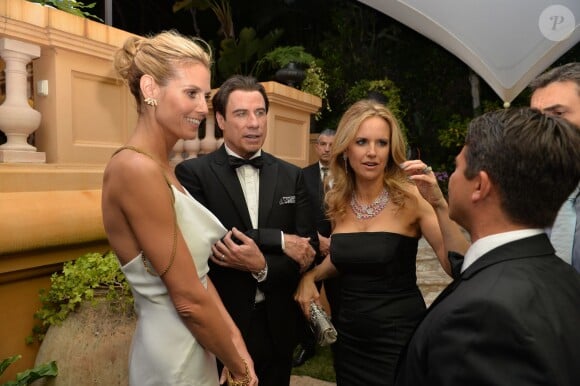Heidi Klum, John Travolta et sa femme Kelly Preston, Oscar Generale à la soirée "Puerto Azul Experience" lors du 67e festival de Cannes le 21 mai 2014.