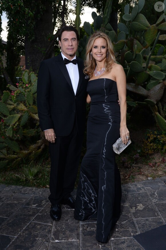 John Travolta et sa femme Kelly Preston à la soirée "Puerto Azul Experience" lors du 67e festival de Cannes le 21 mai 2014.