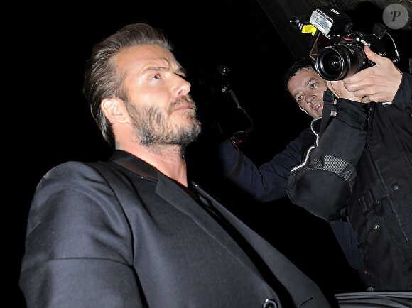 David Beckham à la sortie du restaurant Chiltern Firehouse, après la soirée de lancement de la collection de David Beckham pour H&M à Londres, le 14 mai 2014