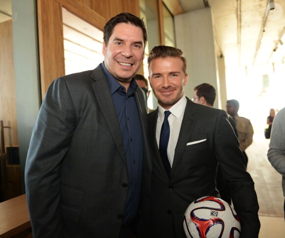 David Beckham et son partenaire Marcelo Claure, lors de l'annonce d'une création de franchise de football à Miami, le 5 février 2014