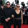John Travolta et sa femme Kelly Preston - Montée des marches du film "Sils Maria" lors du 67e Festival du film de Cannes le 23 mai 2014.