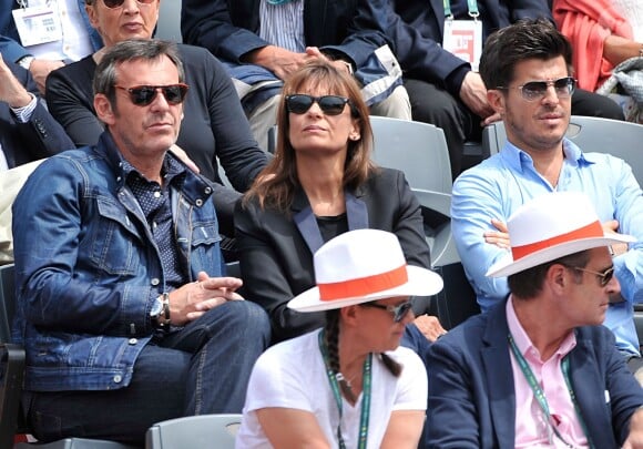 Jean-Luc Reichmann et sa compagne Nathalie aux Internationaux de France de tennis de Roland-Garros à Paris, le 1er juin 2014.