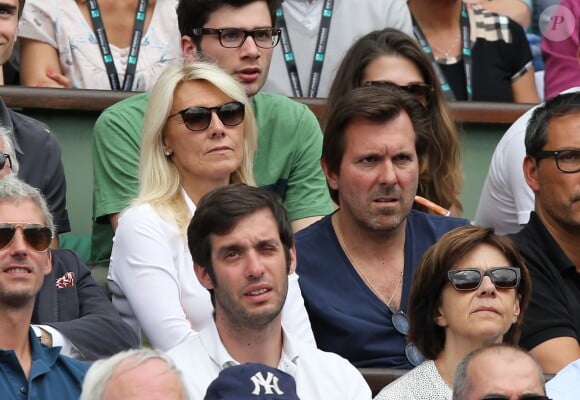 Marie Sara et son mari Christophe Lambert aux Internationaux de France de tennis de Roland-Garros à Paris, le 1er juin 2014.