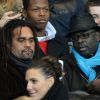 Christian Karembeu et Lilian Thuram lors du match entre le Paris Saint-Germain et l'Olympiacos FC au Parc des Princes à Paris le 27 novembre 2013
