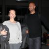 Kendra Wilkinson (enceinte) et son mari Hank Baskett vont prendre un avion à l'aéroport LAX de Los Angeles, le 30 janvier 2014.