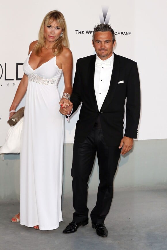 Richard Virenque et sa ravissante compagne Marie-Laure, enceinte de leur premier enfant, lors du dîner de l'amfAR en marge du Festival de Cannes, le 22 mai 2014 à l'Eden Roc au Cap d'Antibes.