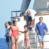 L'acteur australien Simon Baker avec sa femme Rebecca Rigg et leurs fils Claude Blue et Harry Friday profitent de leurs vacances sur un yacht à Saint-Tropez, le 11 juillet 2014.