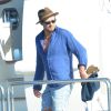 L'acteur australien Simon Baker avec sa femme Rebecca Rigg et leurs fils Claude Blue et Harry Friday profitent de leurs vacances sur un yacht à Saint-Tropez, le 11 juillet 2014.