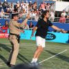 Henri Leconte et le gendarme de Saint-Tropez lors de la 4ème édition du Classic Tennis Tour à Saint-Tropez, le 12 juillet 2014.