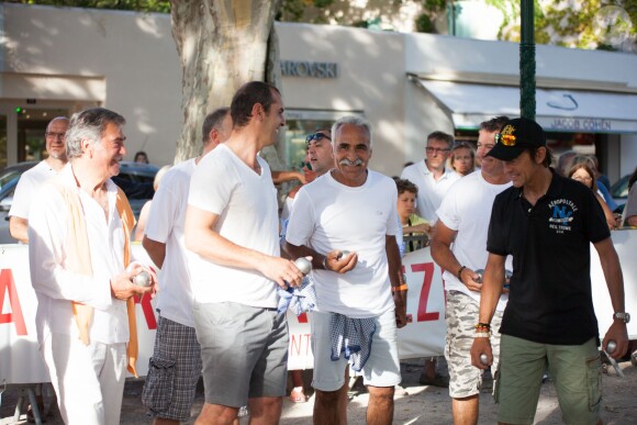Cédric Pioline, Mansour Bahrami et Alexandre Debanne lors d'une partie de pétanque organisée en marge de la 4ème édition du Classic Tennis Tour à Saint-Tropez, le 11 juillet 2014.