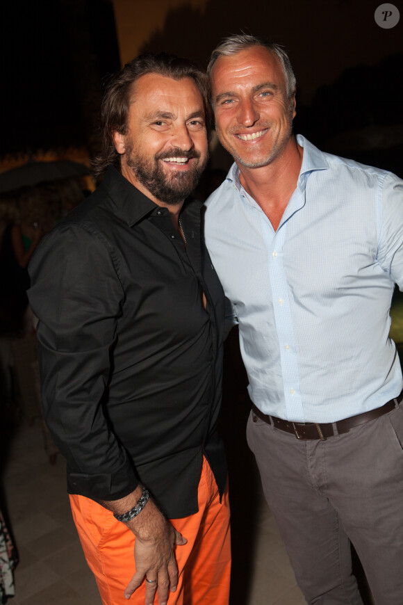 Henri Leconte et David Ginola lors de la soirée d'ouverture de la 4ème édition du Classic Tennis Tour à Saint-Tropez, le 11 juillet 2014.